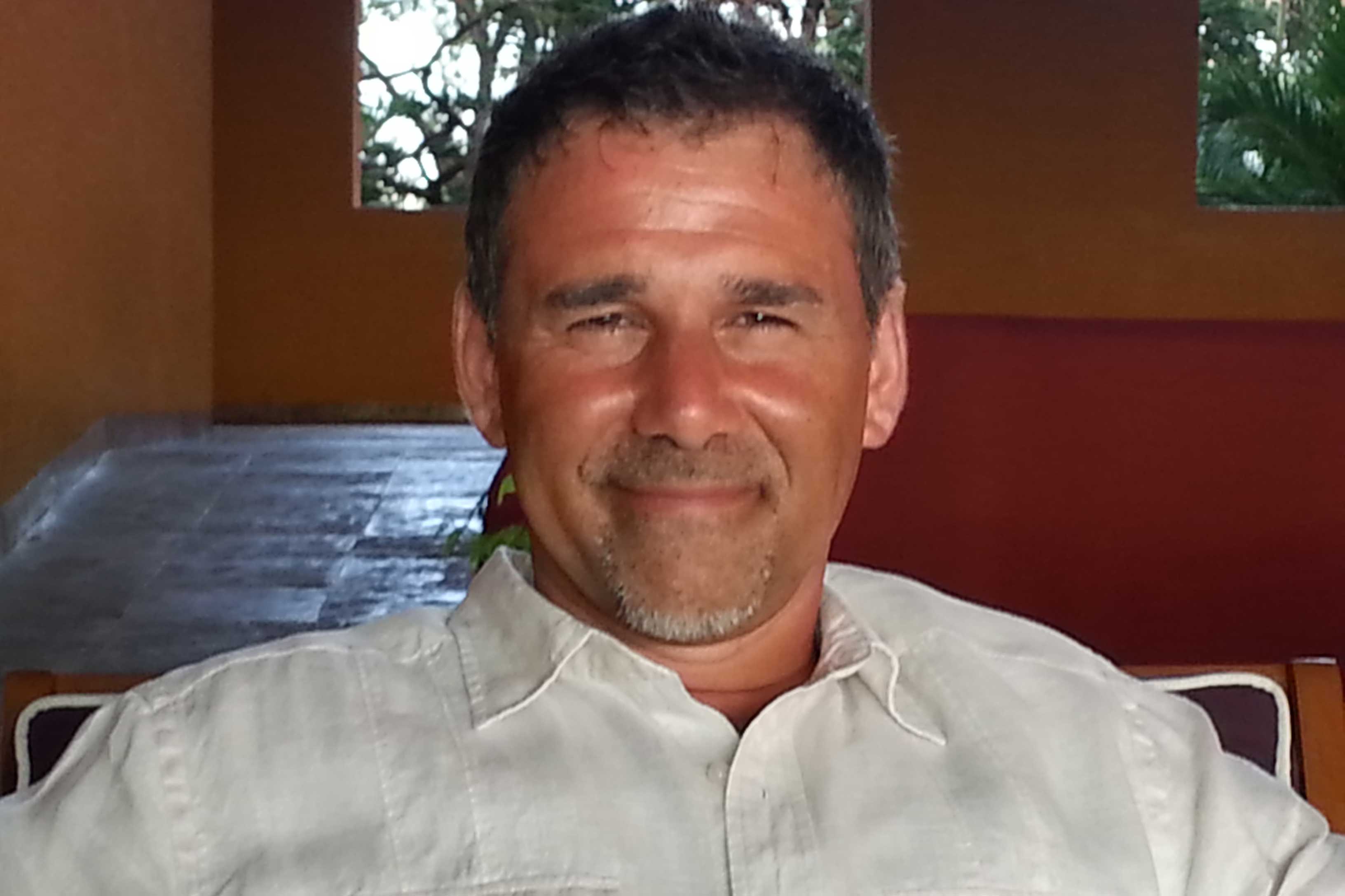 An image of Gino, who is smiling at the camera.