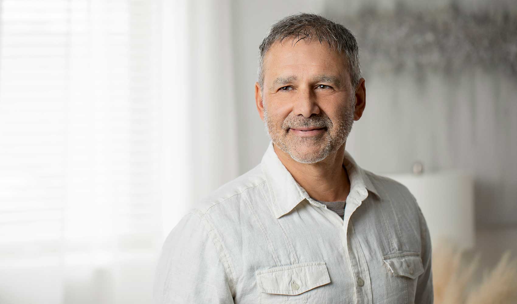 An image of Gino, who is smiling at the camera.