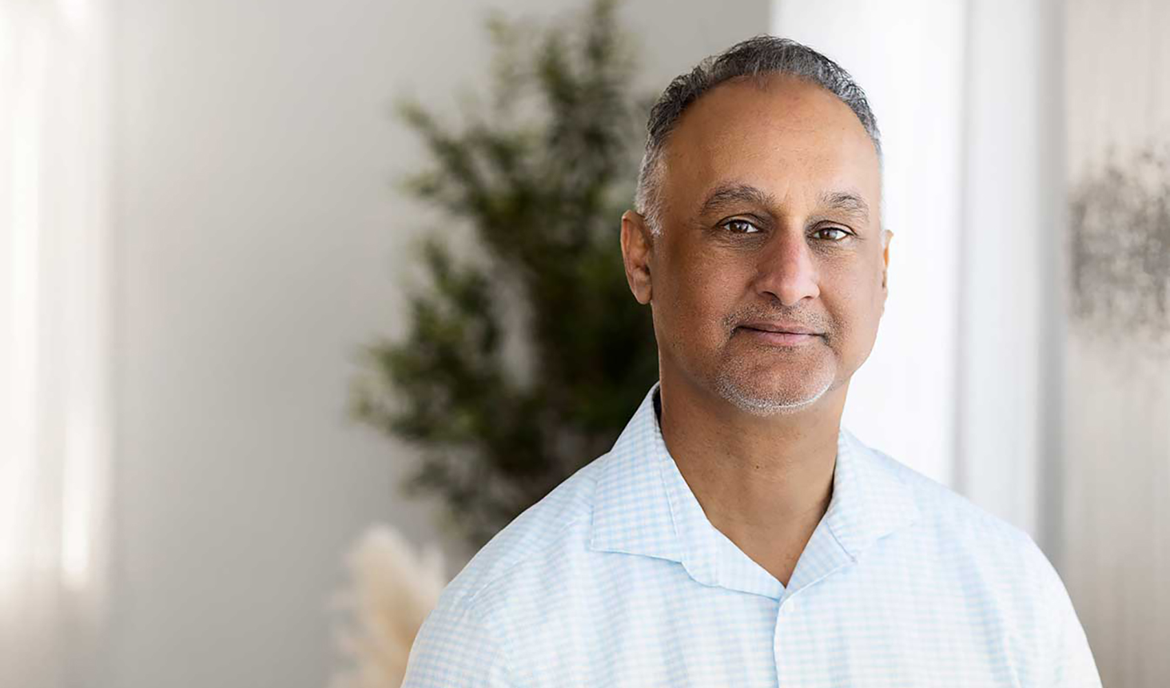 An image of Narinder, who is smiling at the camera.